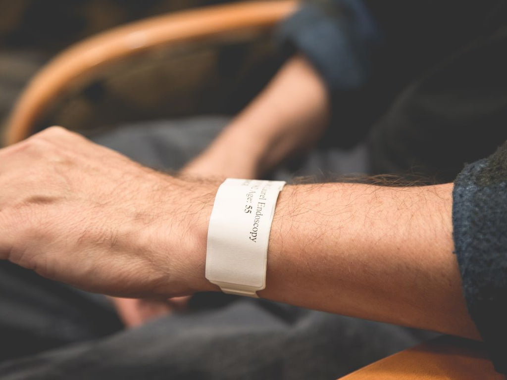 Elderly with a medical bracelet with her medical information on it