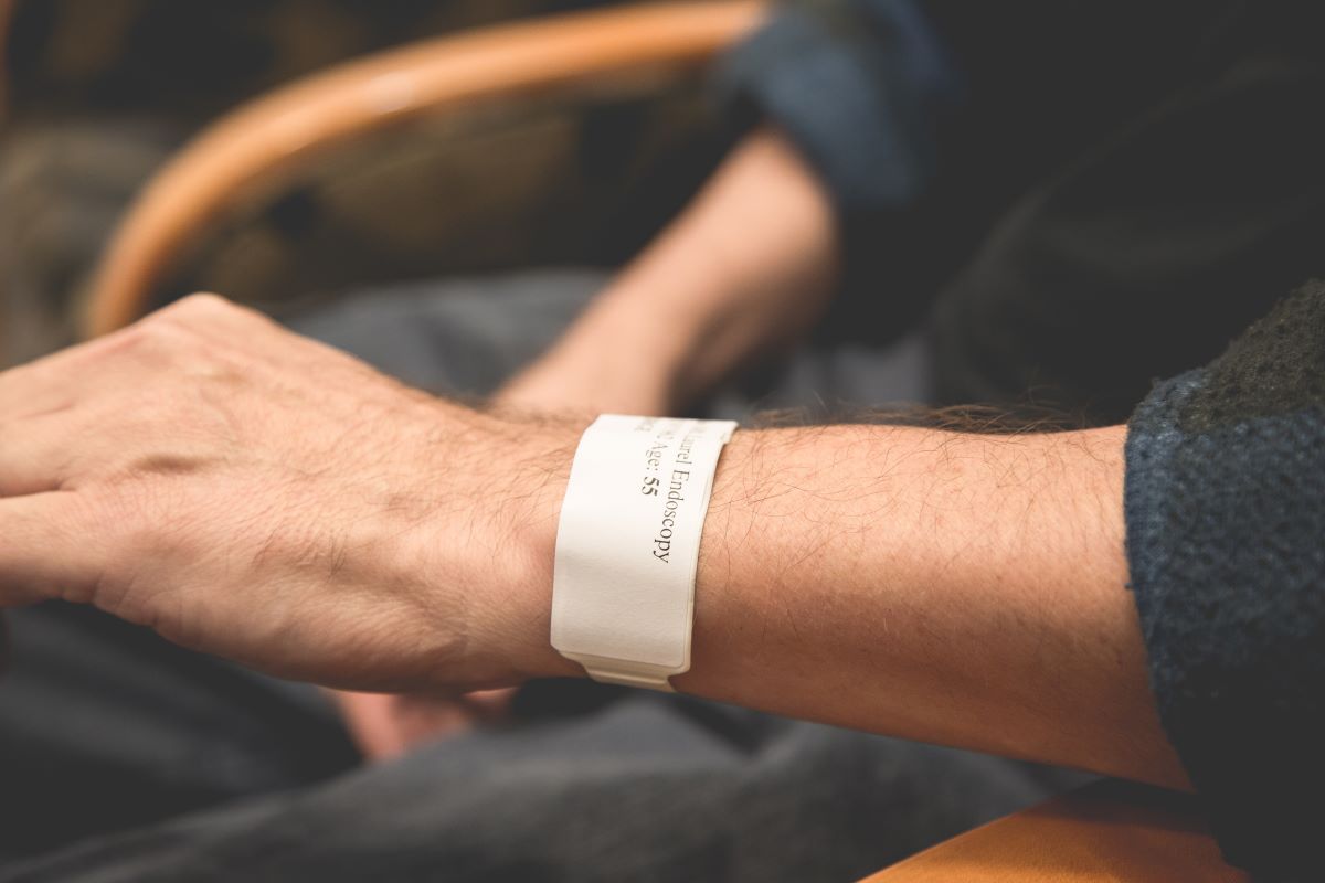 Elderly with a medical bracelet with her medical information on it