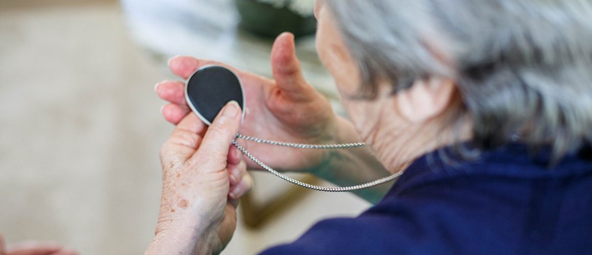 Elderly lady with alarm