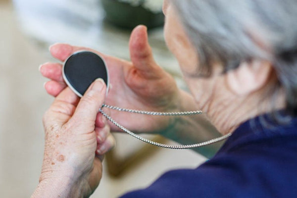 Elderly lady with alarm