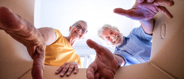 Elderly couple with removal box