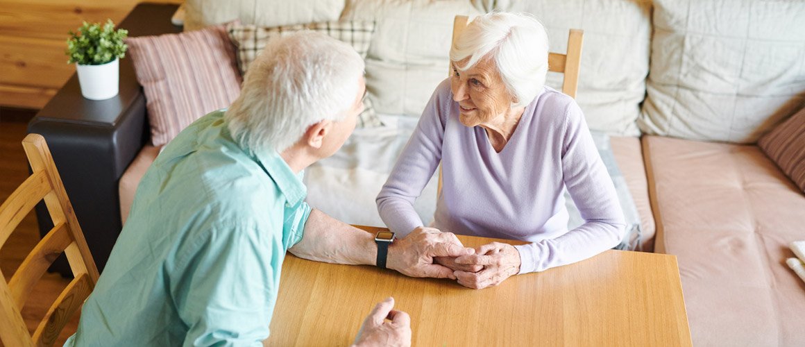 Elderly couple discussing relationship