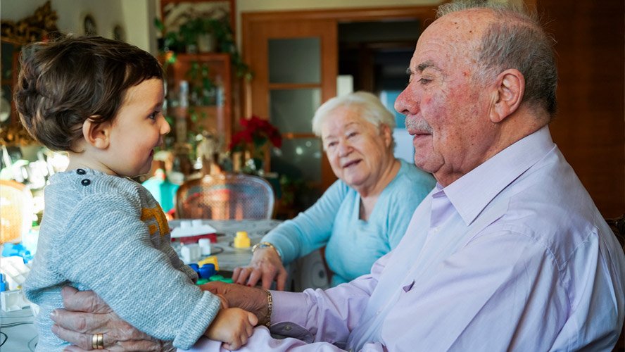 Elderly man with granddaughter