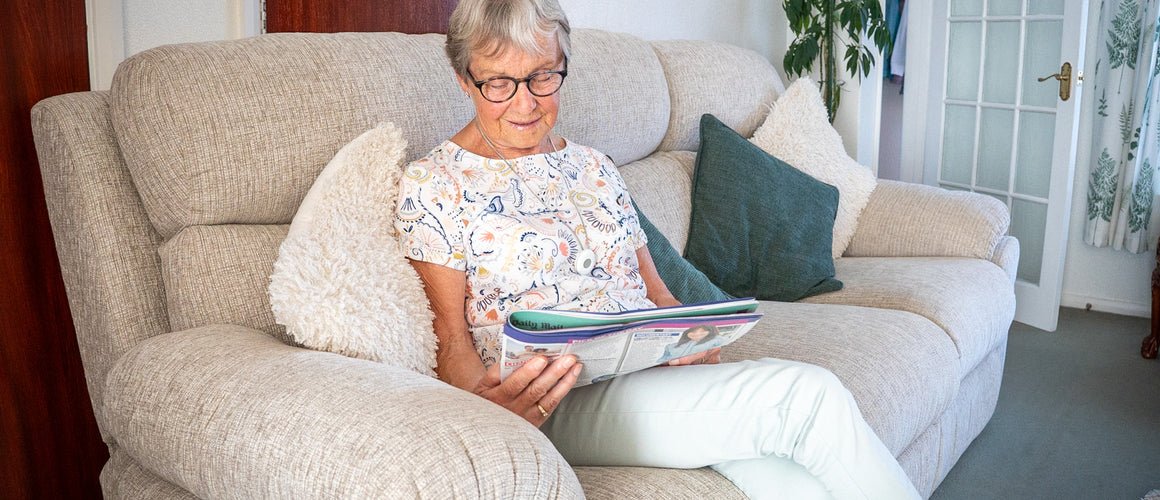 Elderly woman with her digital personal alarm