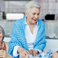 Elderly women knitting together