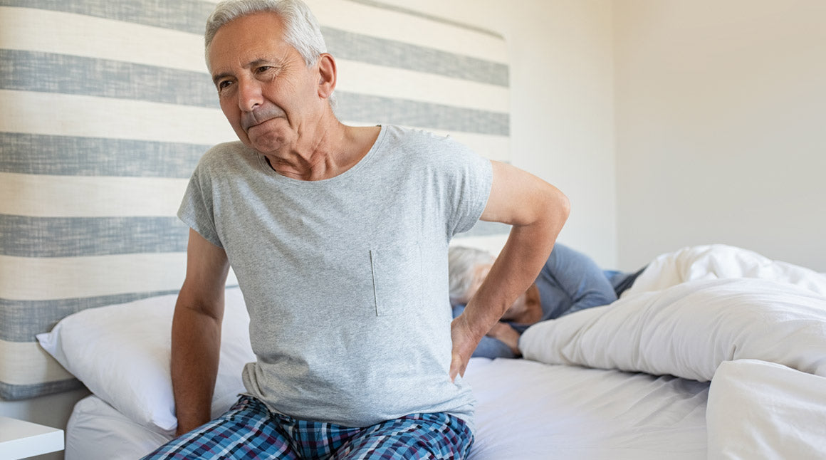 Elderly man with sciatica back pain