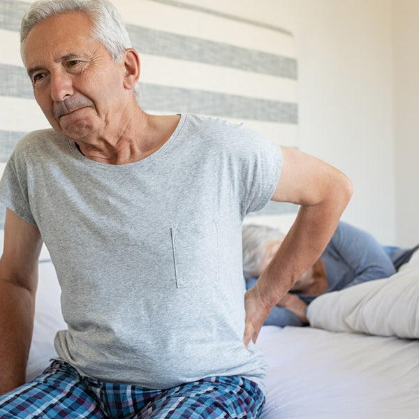 Elderly man with sciatica back pain