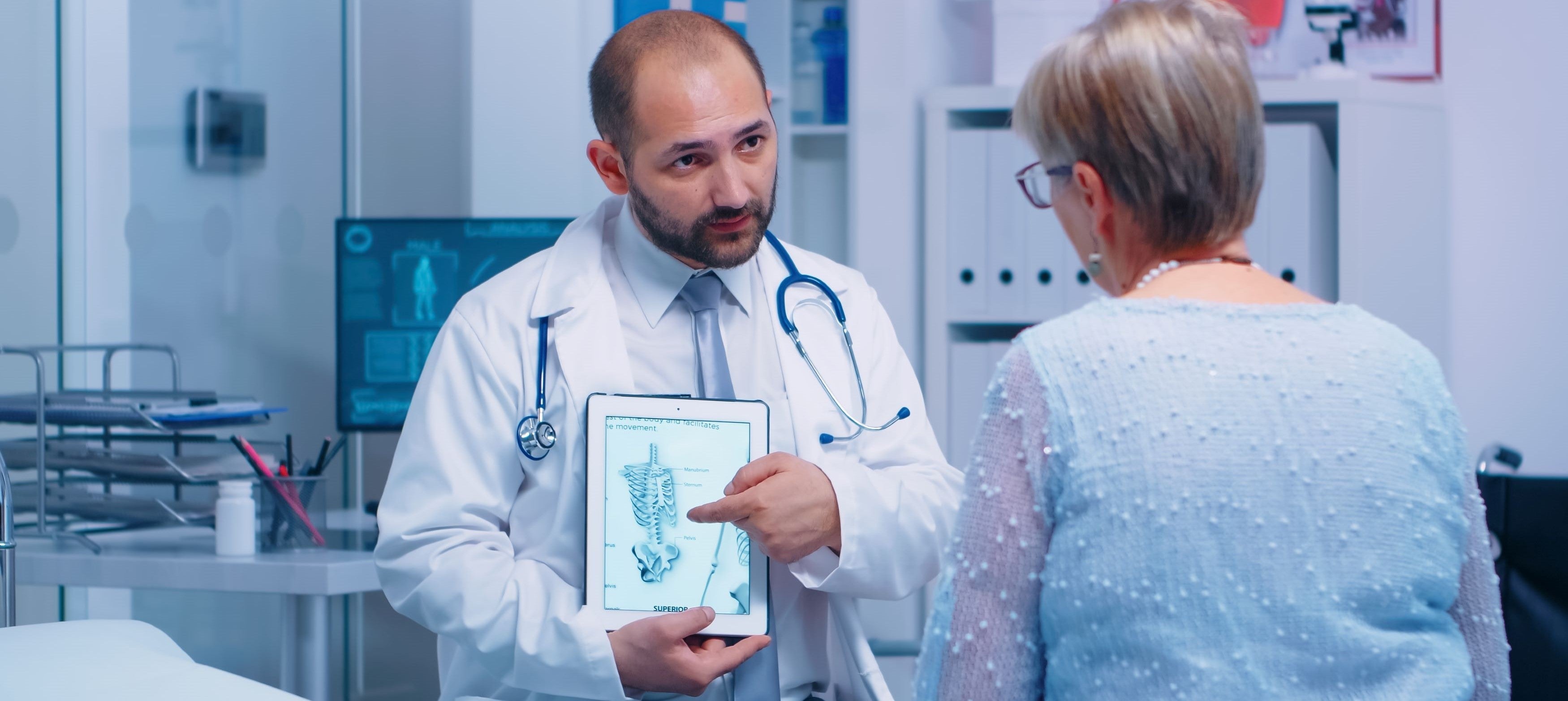 GP giving advice on Osteoporosis to an elderly woman