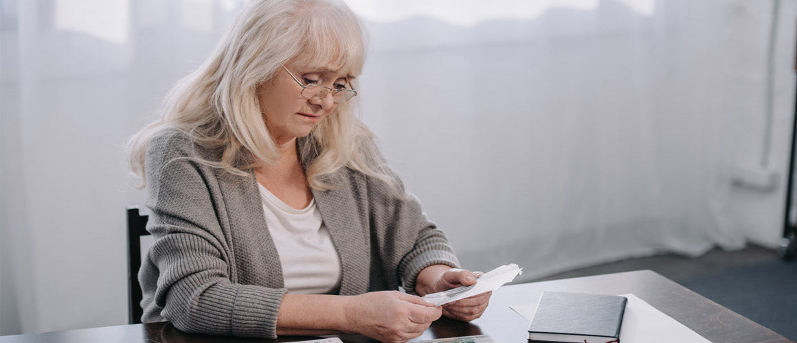 Elderly lady saving money