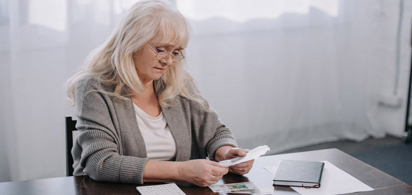 Elderly lady saving money