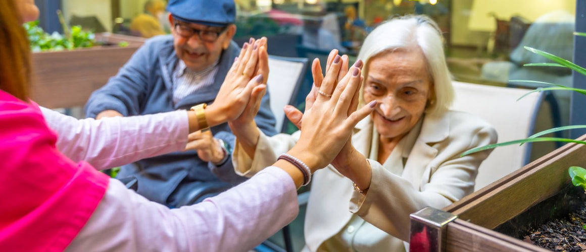 Elderly woman feeling happy with her social group