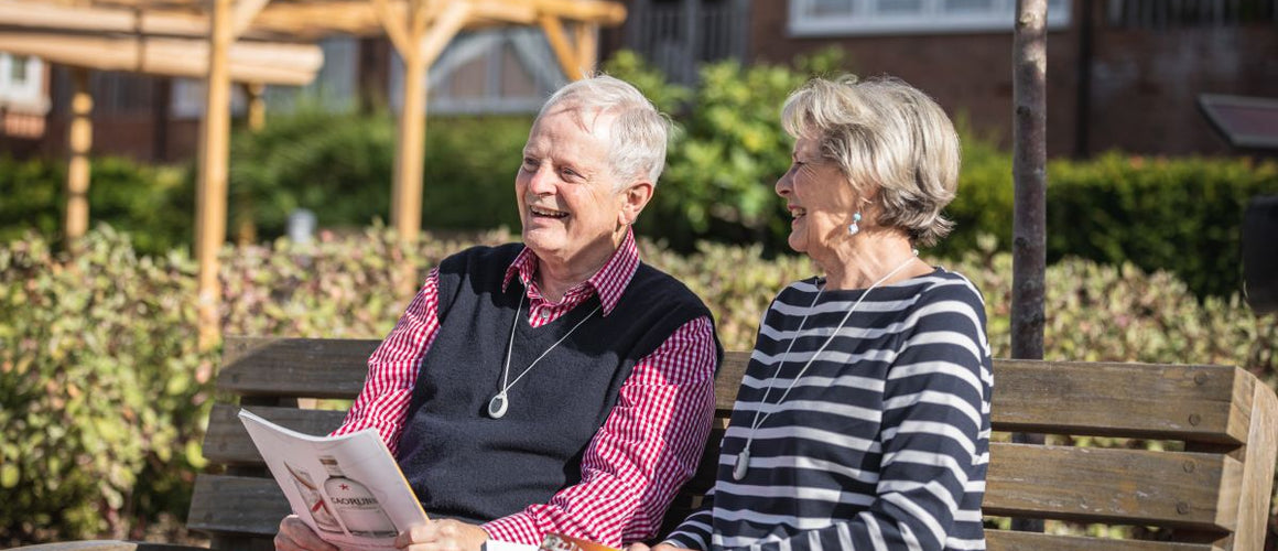 Elderly couple sitting together