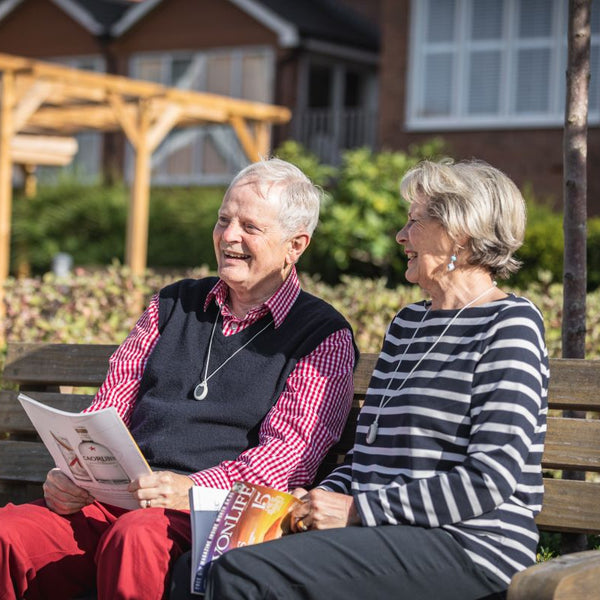 Elderly couple sitting together