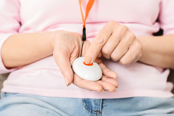 Women pressing her waterproof personal alarm