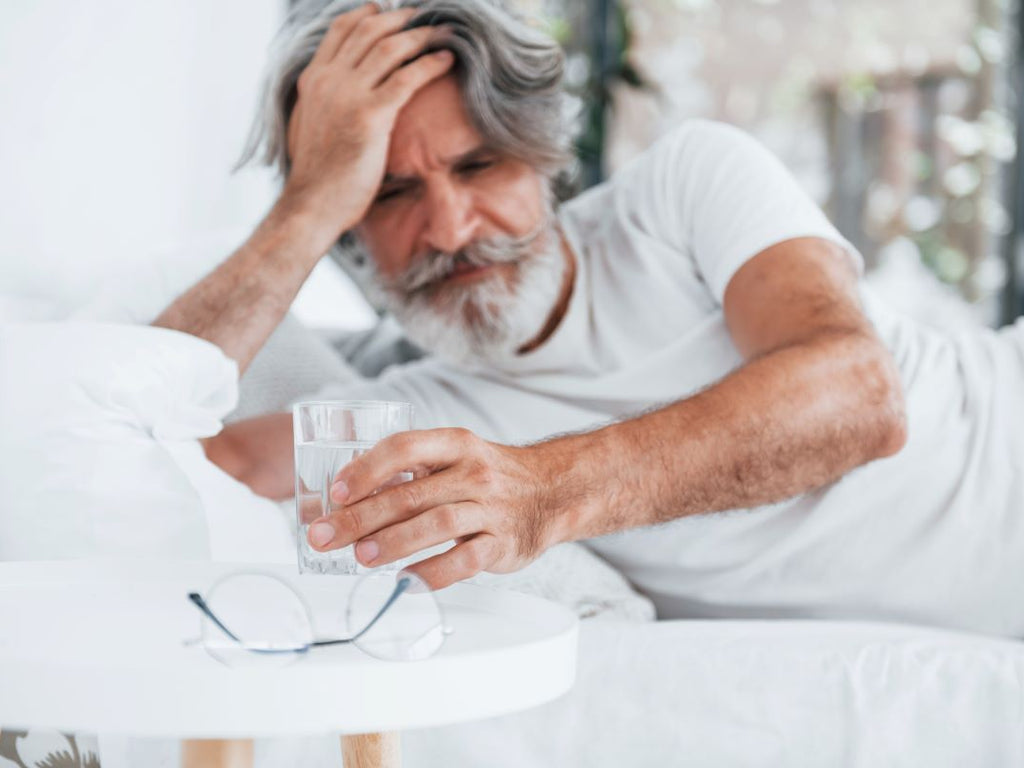 Elderly man feeling dizzy
