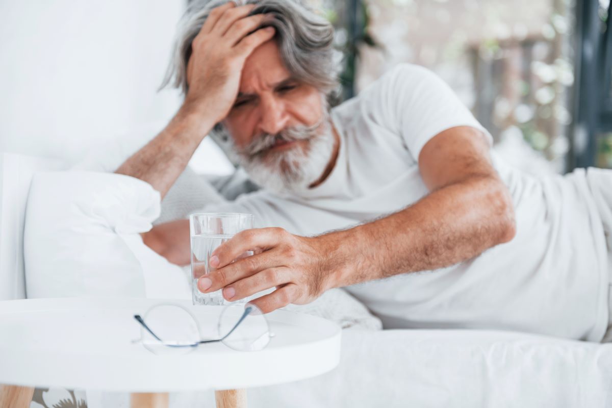 Elderly man feeling dizzy