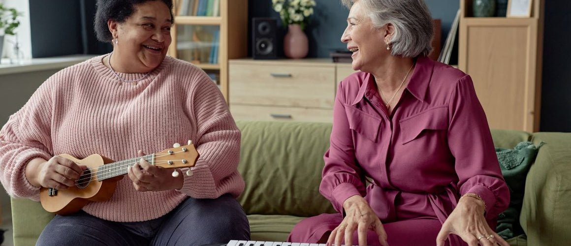 Elderly woman playing musical instruments with her friend