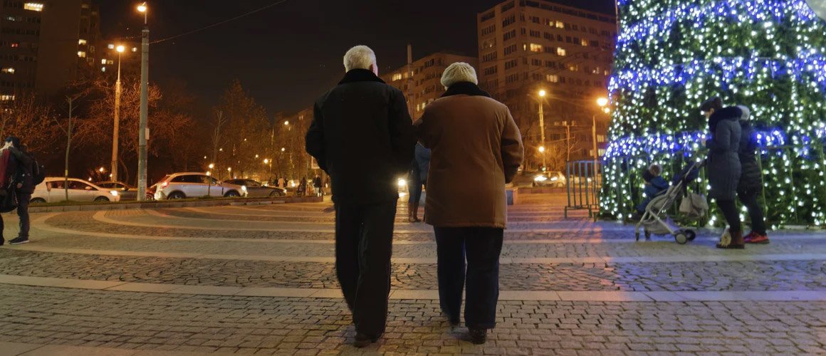 Elderly couple walking in winter