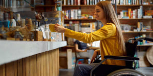 Woman in wheelchair in coffee shop