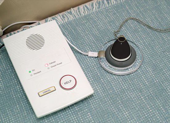 Emergency button and pendant on table