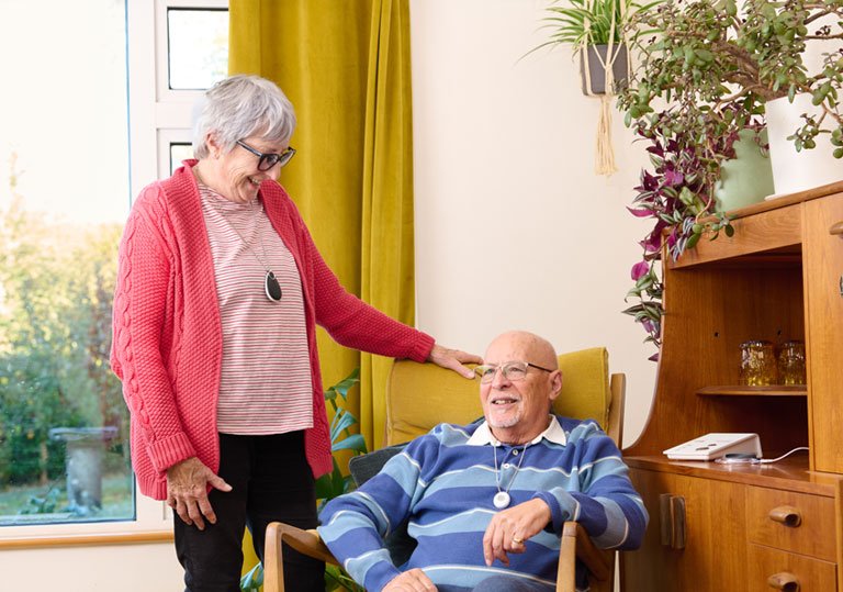 Older couple with elderly personal alarms