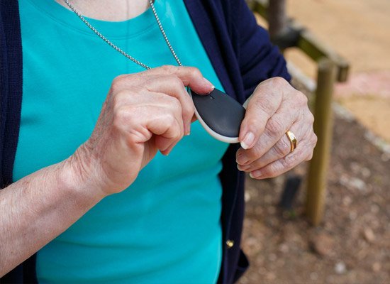 GPS dementia alarm on lady's neck
