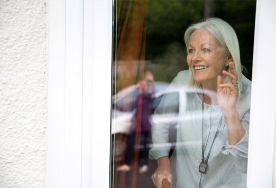 Older lady looking out of the window