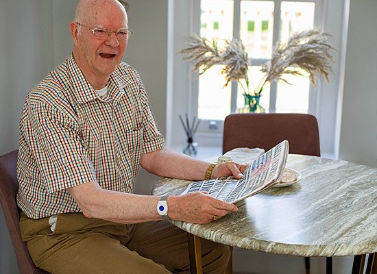 Man with falls alert braelet