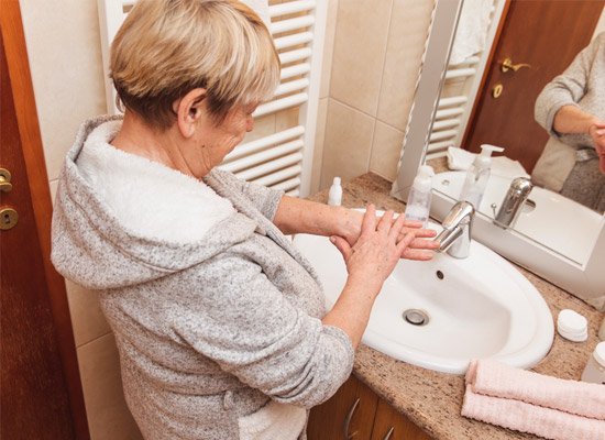 Older adult in bathroom