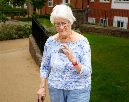 Lady with GPS mobile alarm