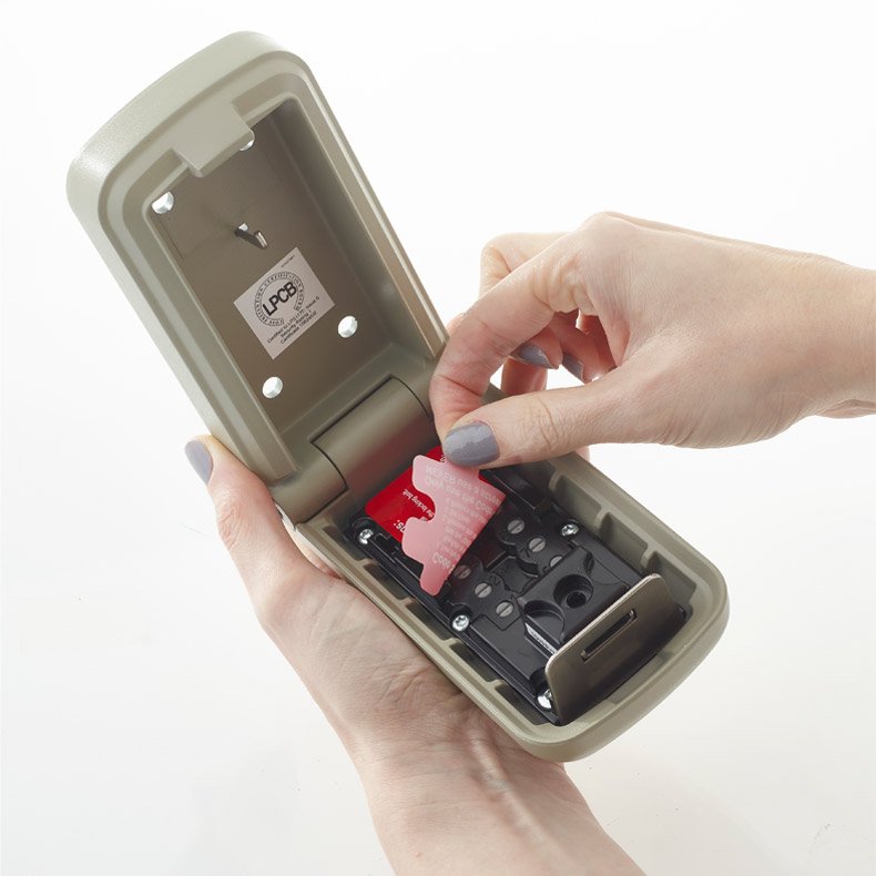 Someone holding key safe in hand