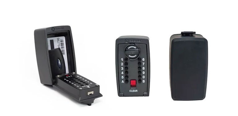 A black electronic keyless entry or security device shown from three angles on a white background: one open showing internal components, one front view with a keypad and red button, and one side profile.
