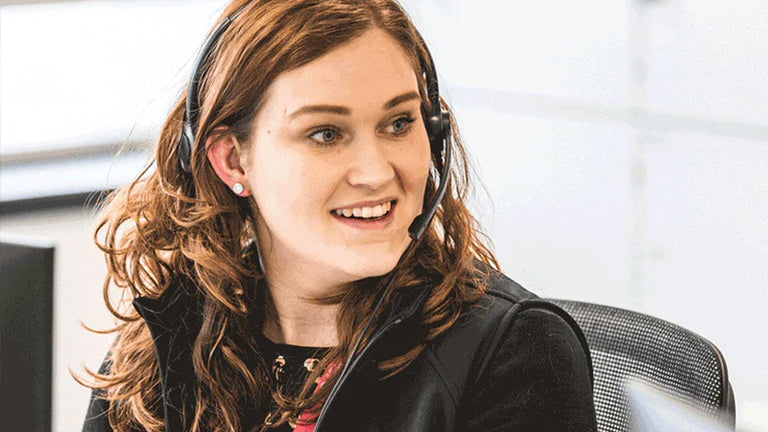 Person wearing a headset in an office setting