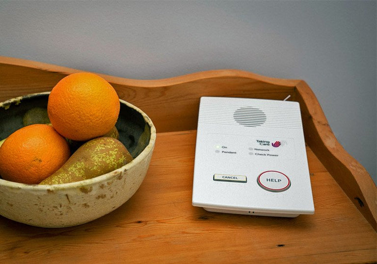 Digital alarm base unit on table
