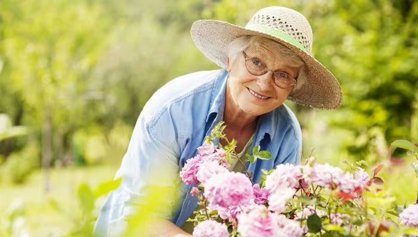 Elderly lady in garden