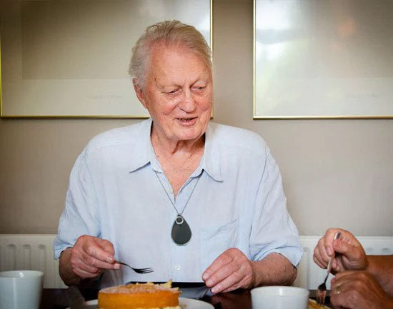 Older man sat at home