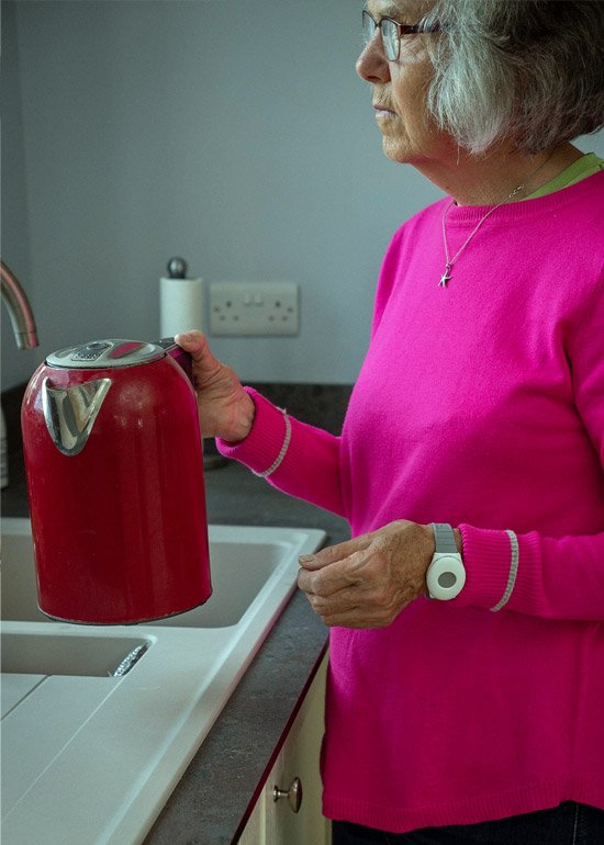Older person wearing a panic button on her wrist