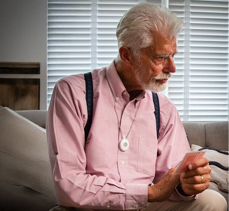 Older man sat wearing digital alarm