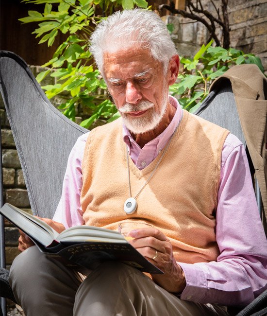 Elderly man with necklace alarm