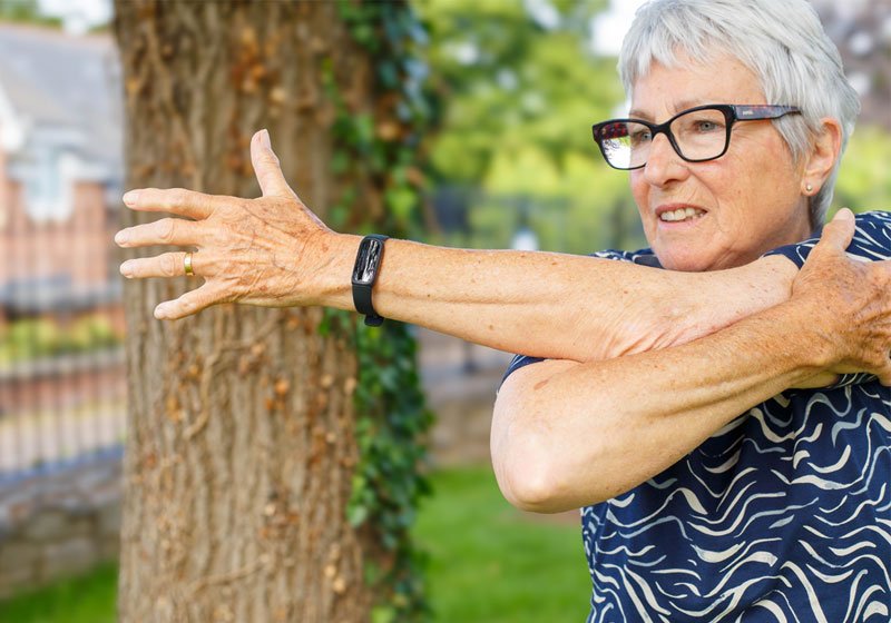 Older woman doing stretching exercises
