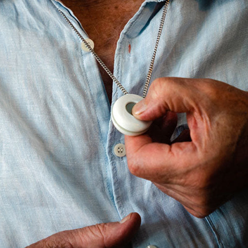 Person pressing alarm pendant