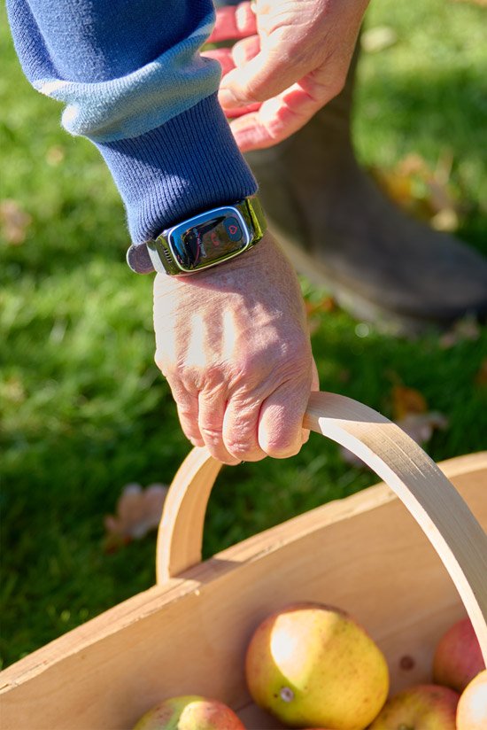 Man's wrist with call button alarm