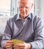 Senior man with care alarm