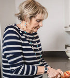 Elderly person with care alarm on wrist