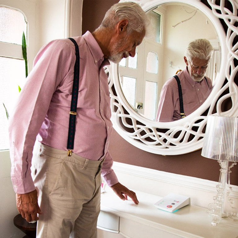 Man looking at alarm unit