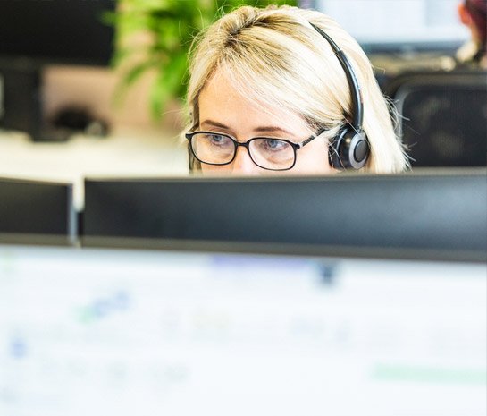 Person wearing a headset in an office setting