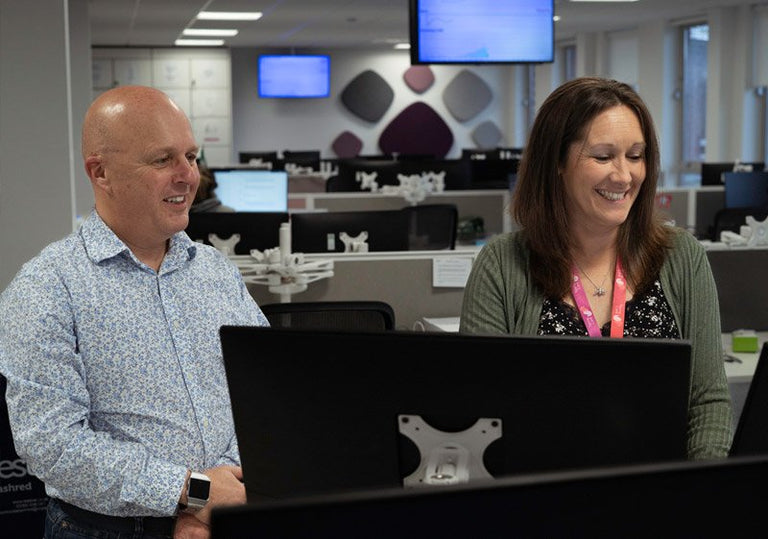 Two staff from Taking Care