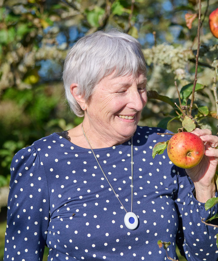 Senior woman with fall alarm pendant
