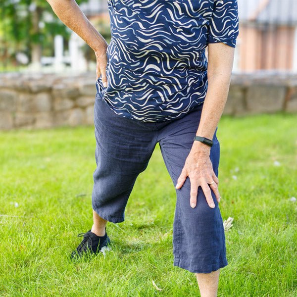 Old lady stretching outdoors