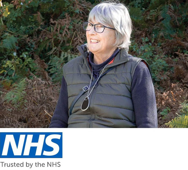 GPS falls pendant worn by older person